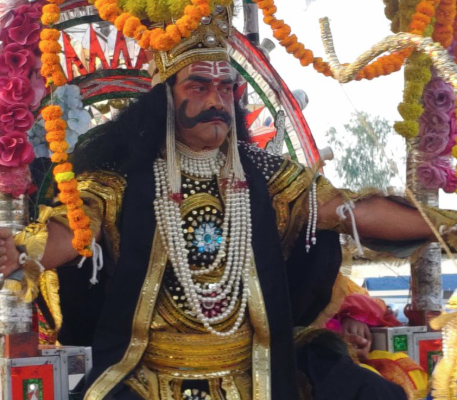 Ravana tableau rides on chariot in Akbarpur, Kanpur countryside, touring the city amidst traditional musical instruments